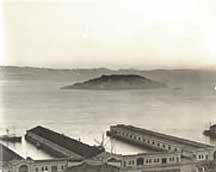 1933, Wharf and piers with bulkhead buildings and connectors added.